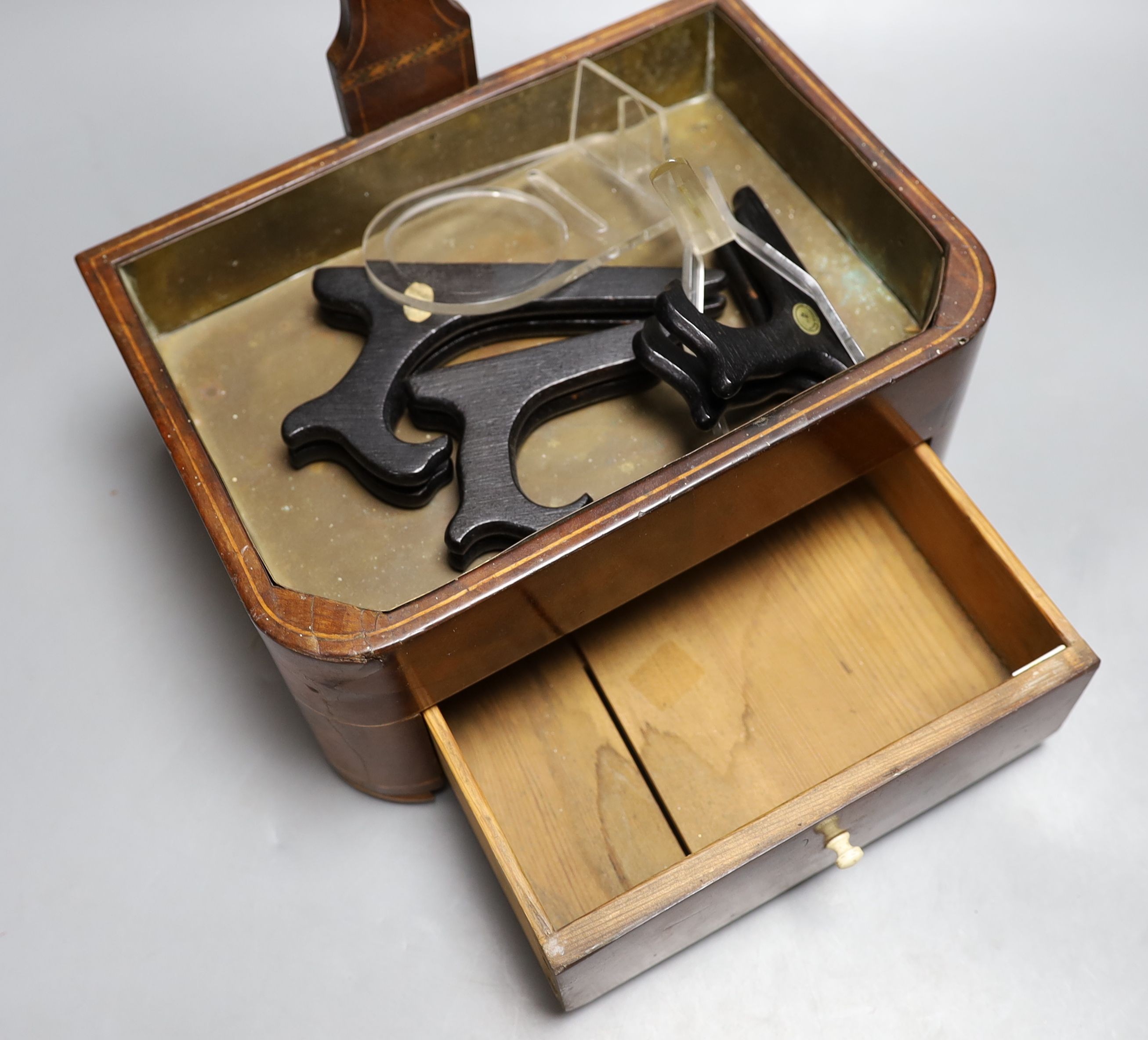 A 19th century satinwood strung mahogany stick stand with fitted drawer, 54 cms high.